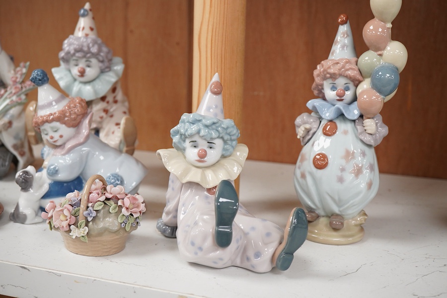 Seven Lladro figures, four clowns, a Geisha girl, a reclining girl and a small basket of flowers